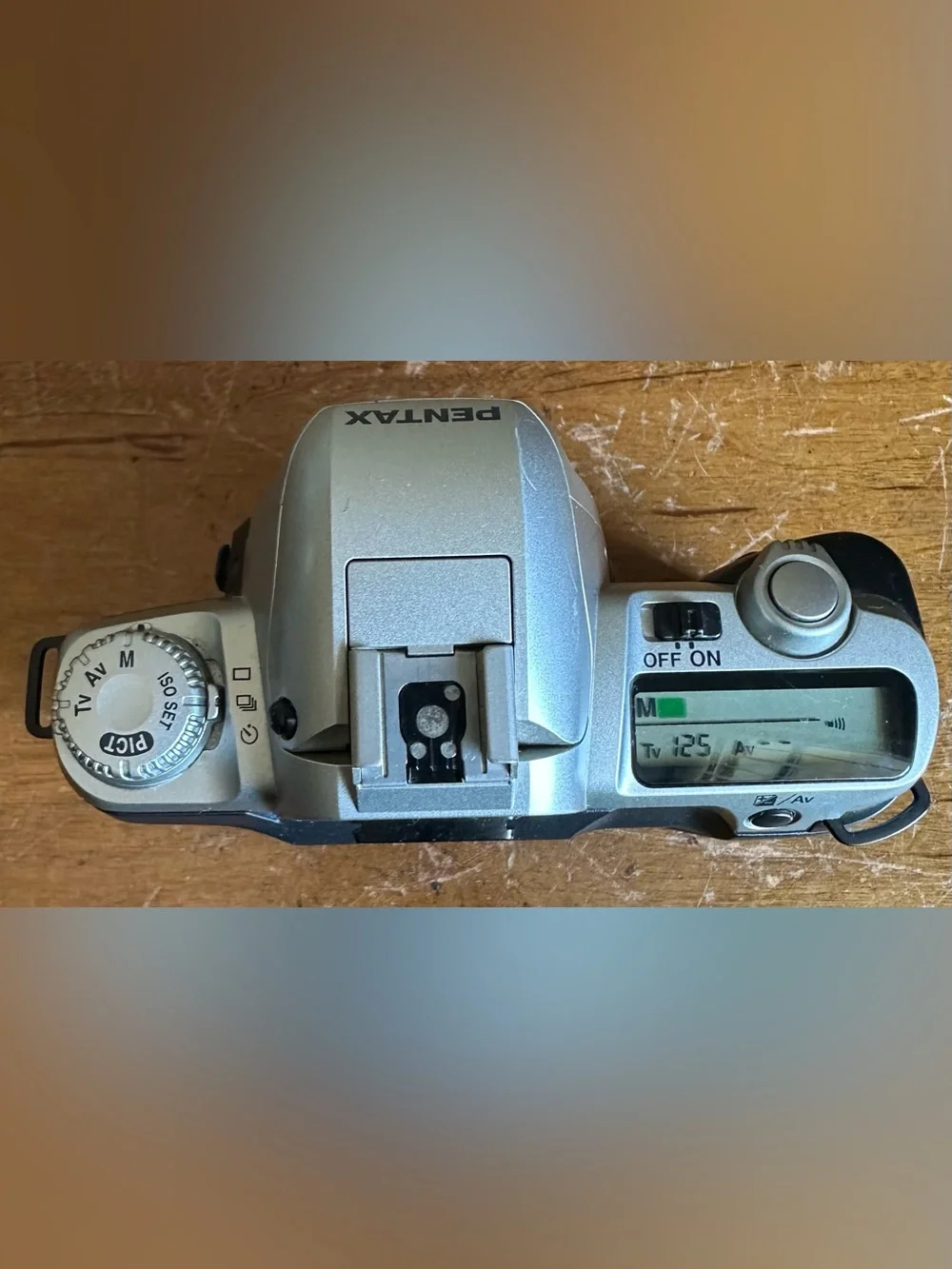 Pentax Silver SLR Camera Body with White Lens Cap